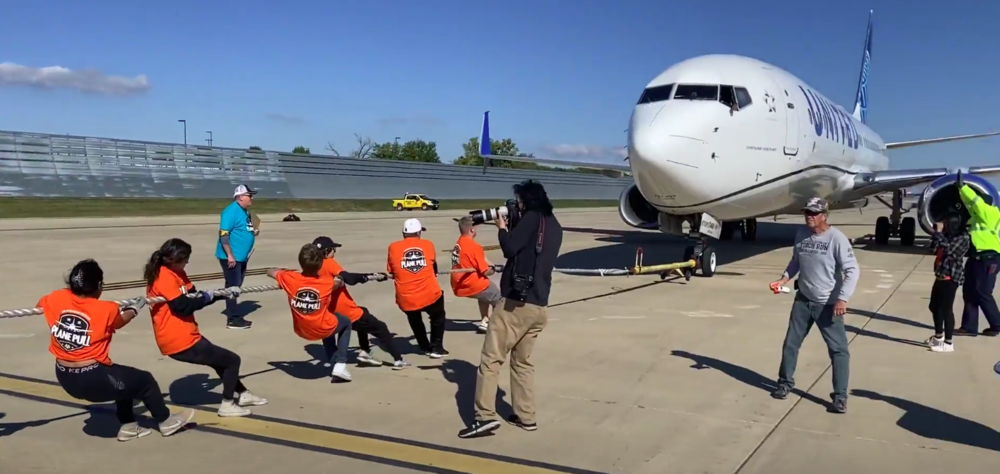 McHenry Strength team raises funds for Special Olympics by pulling a plane