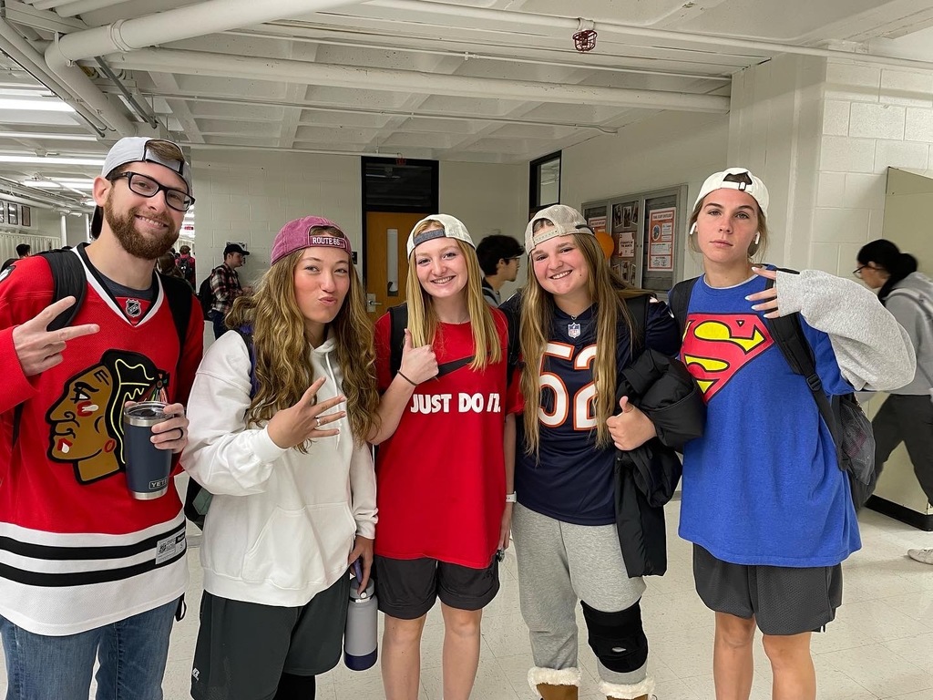 Students and teacher in Adam Sandler gear with backwards hats
