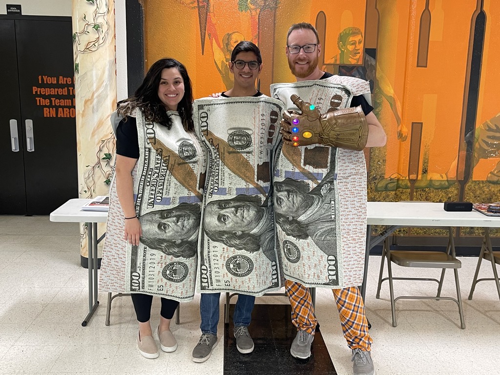 Counselors dressed as money