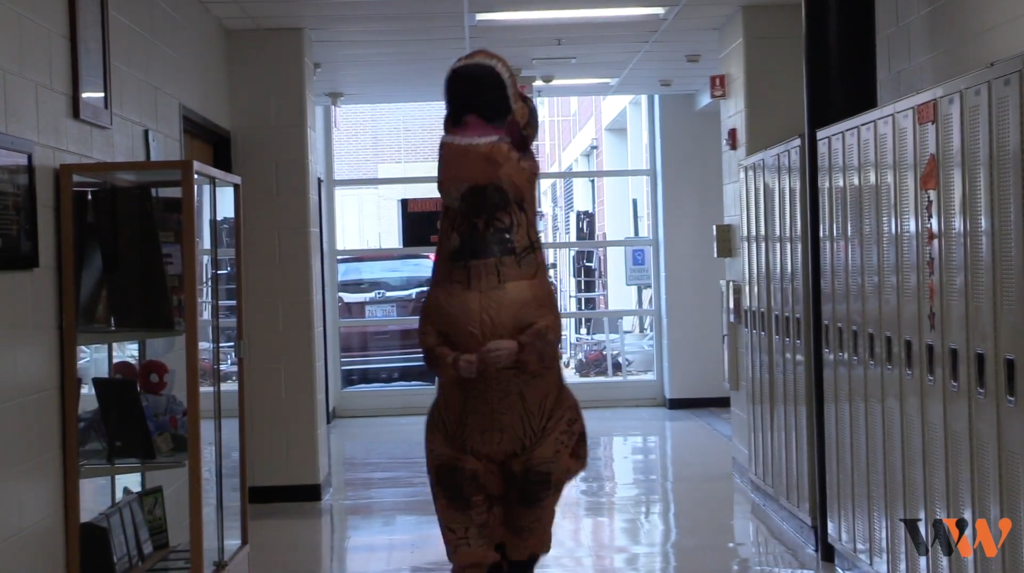 Student in a dinosaur costume