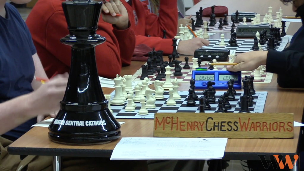 McHenry Chess Warriors sign with a chess board