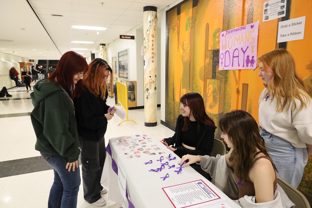 Students at the Women's Day booth