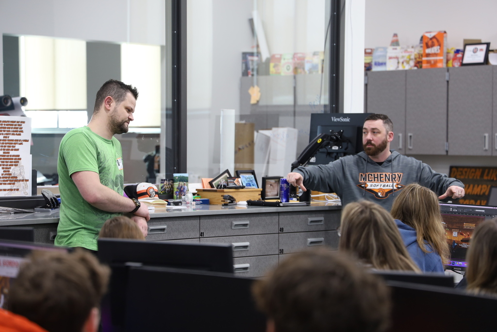 Daniel and Mr. Connor talking to students