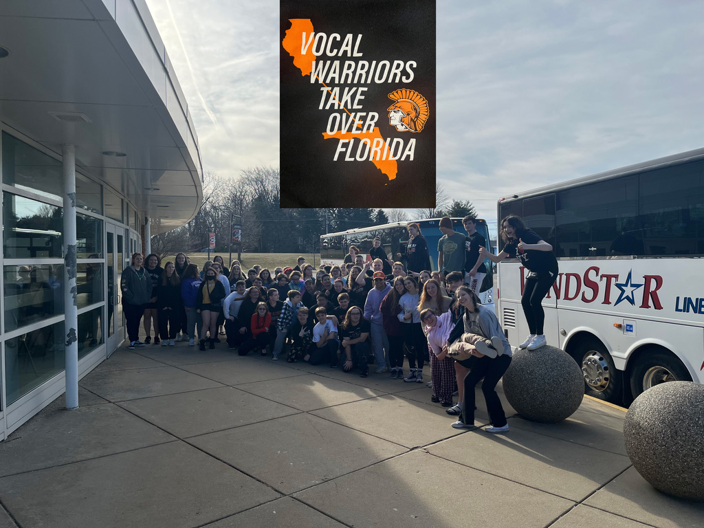 A graphic saying Vocal Warriors Take Over Florida with a Warrior head and the state of Illinois with a line to Florida and the students outside standing in front of the buses