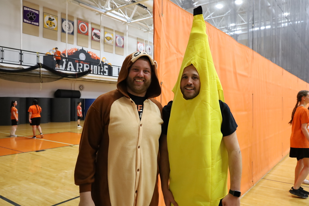 One teacher dressed as a monkey and one teacher dressed as a banana