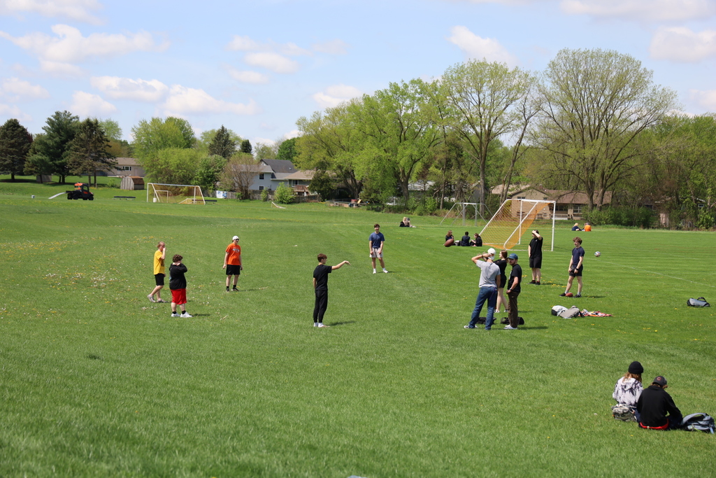 Students outside on the soccer field