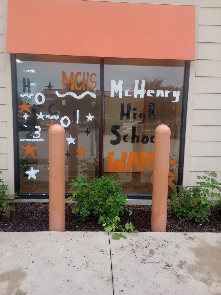 Dunkin Donuts window decorated with "HoCo2023 McHenry High School Warriors'