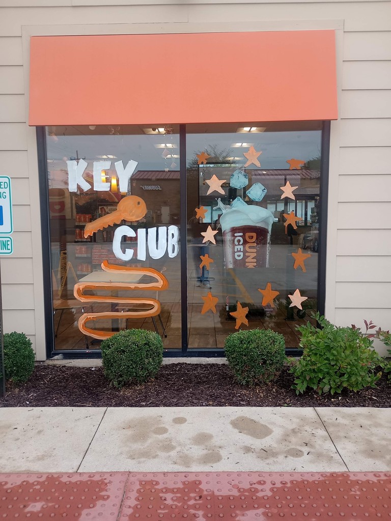 Dunkin Donuts window decorated with Key Club